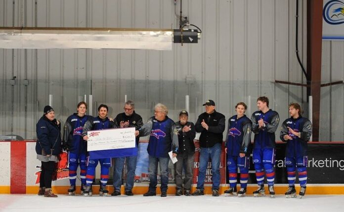 Cheque presentation in Three Hills on January 31, 2025 at the annual Mountain View Colts charity hockey game in support of the Ride for Dad. (Rural AB Motorcycle Ride for Dad Facebook page)